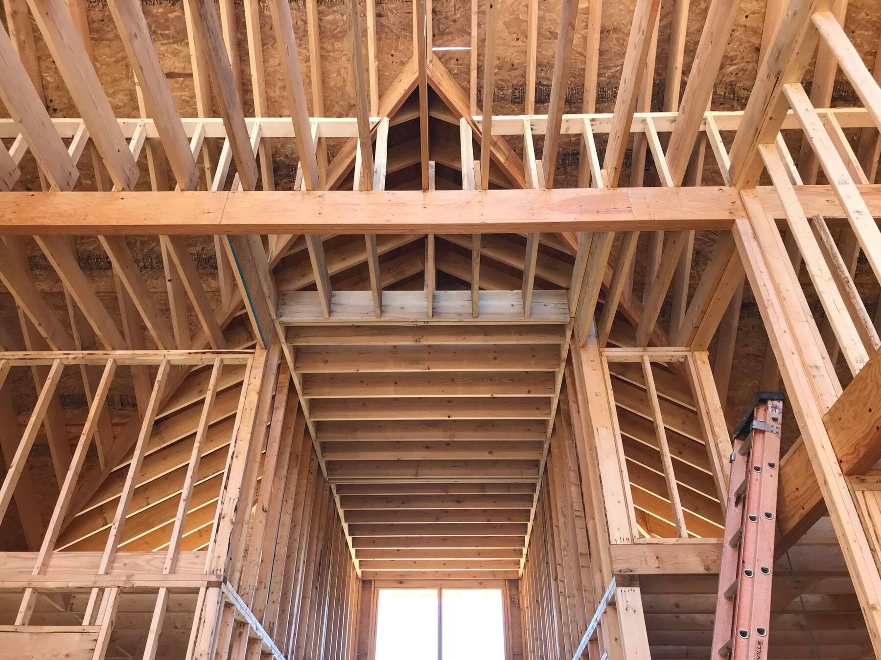 Cathedral ceiling roof framing inside a custom home under construction in Lewes, DE