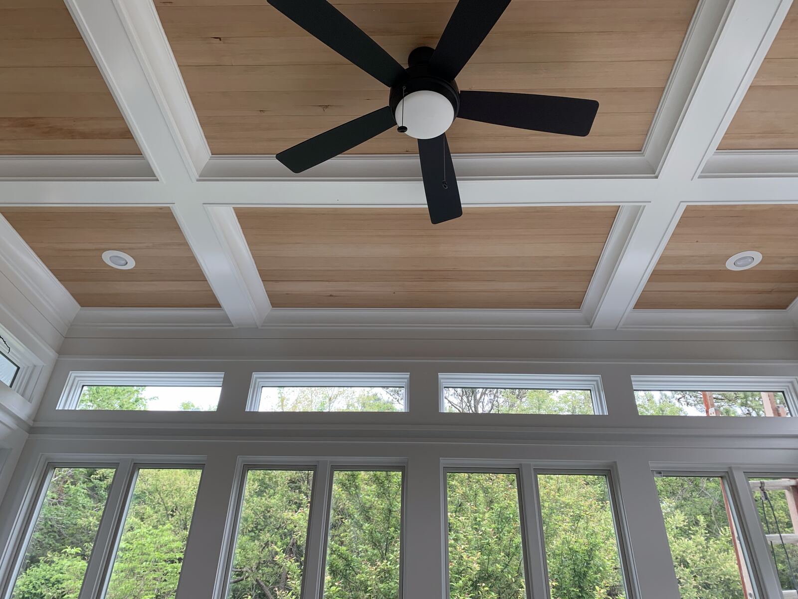 Coffered wood-plank ceiling detail with craftsman trim in a Lewes, DE home