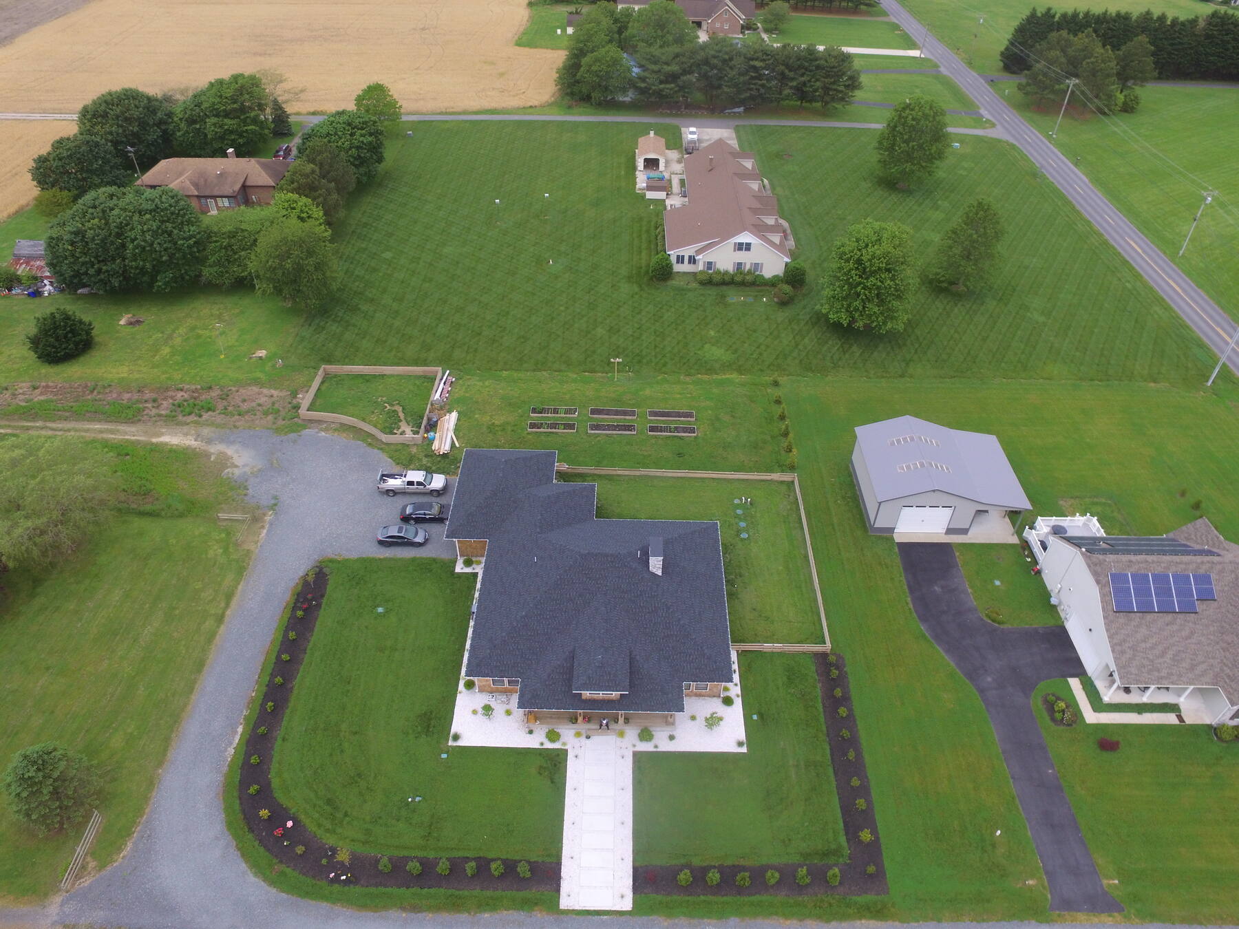 Aerial view of a custom home and grounds built by Arthur Charles Homes in Lewes, DE