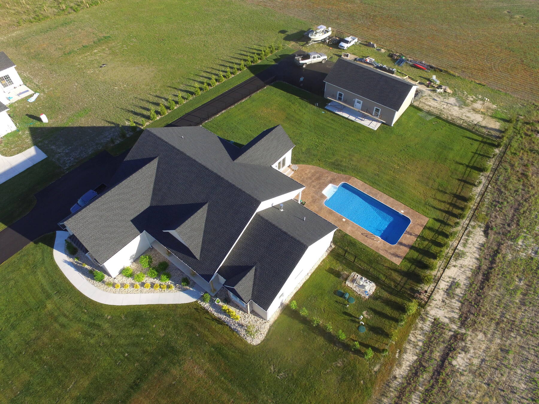 Aerial view of a custom home with pool in Sussex County, DE