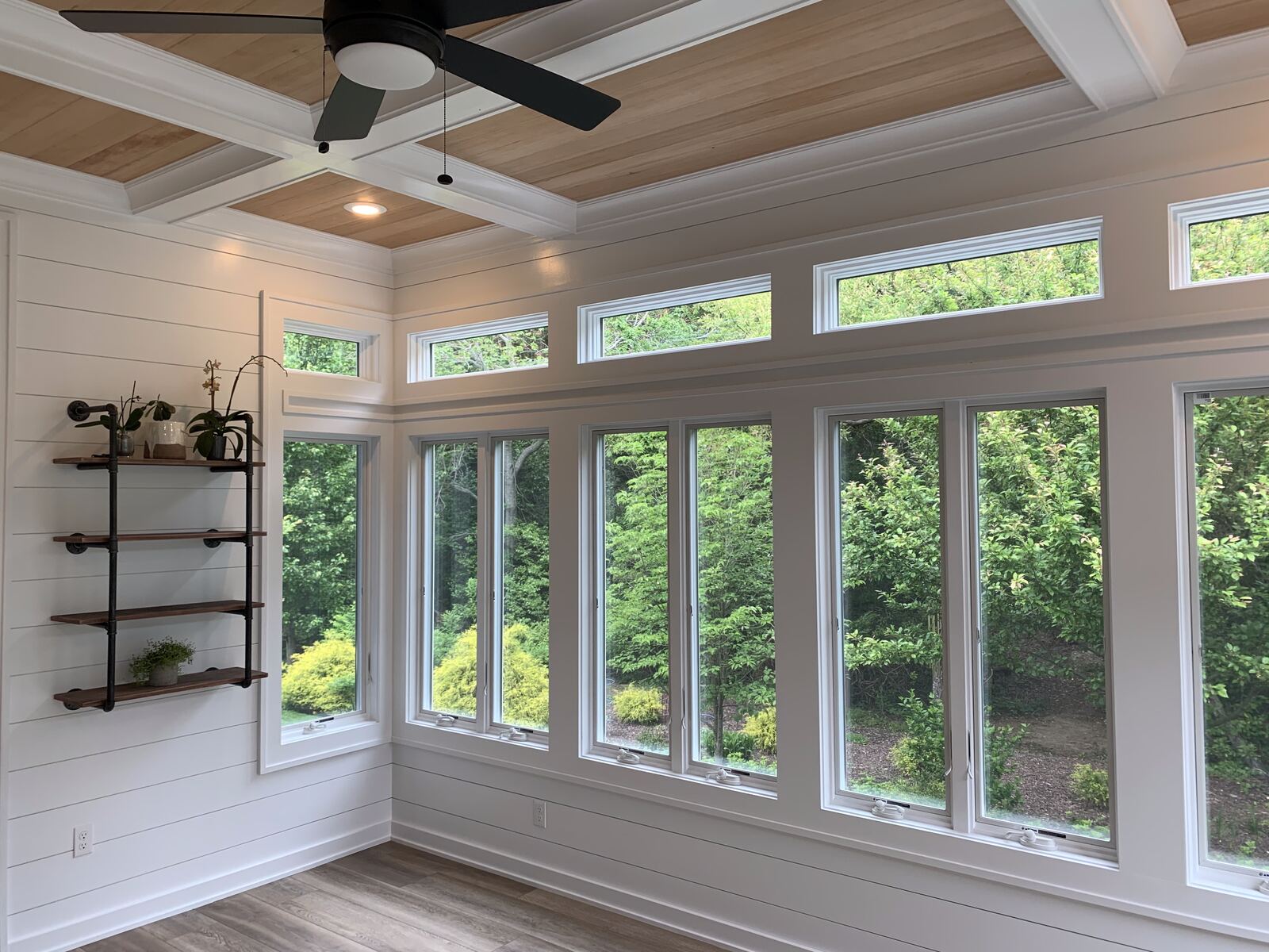 Shiplap wall detail and casement windows in a three-season room in Sussex County, DE