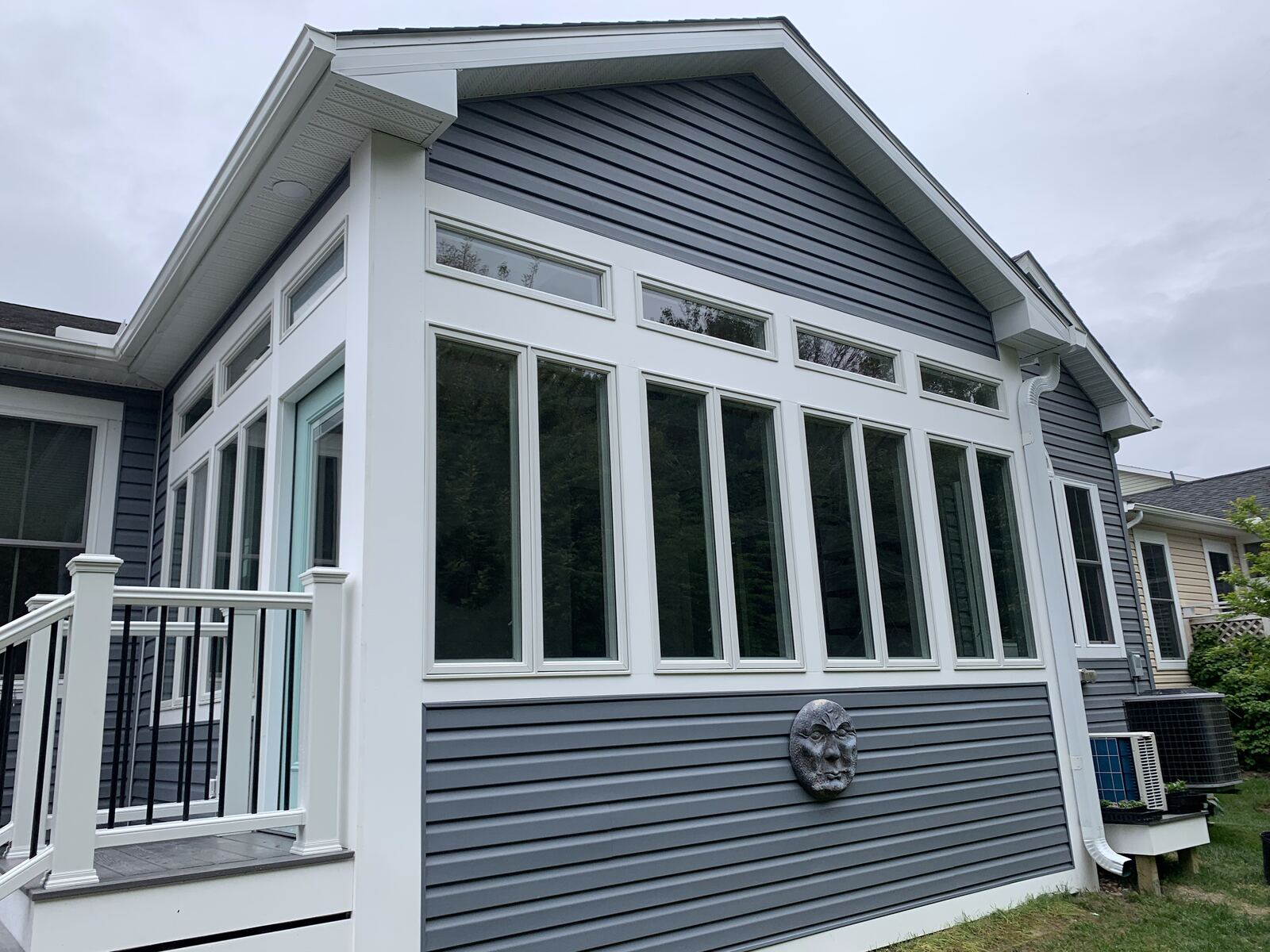 Exterior of a three-season room addition with full window wall in Sussex County, DE